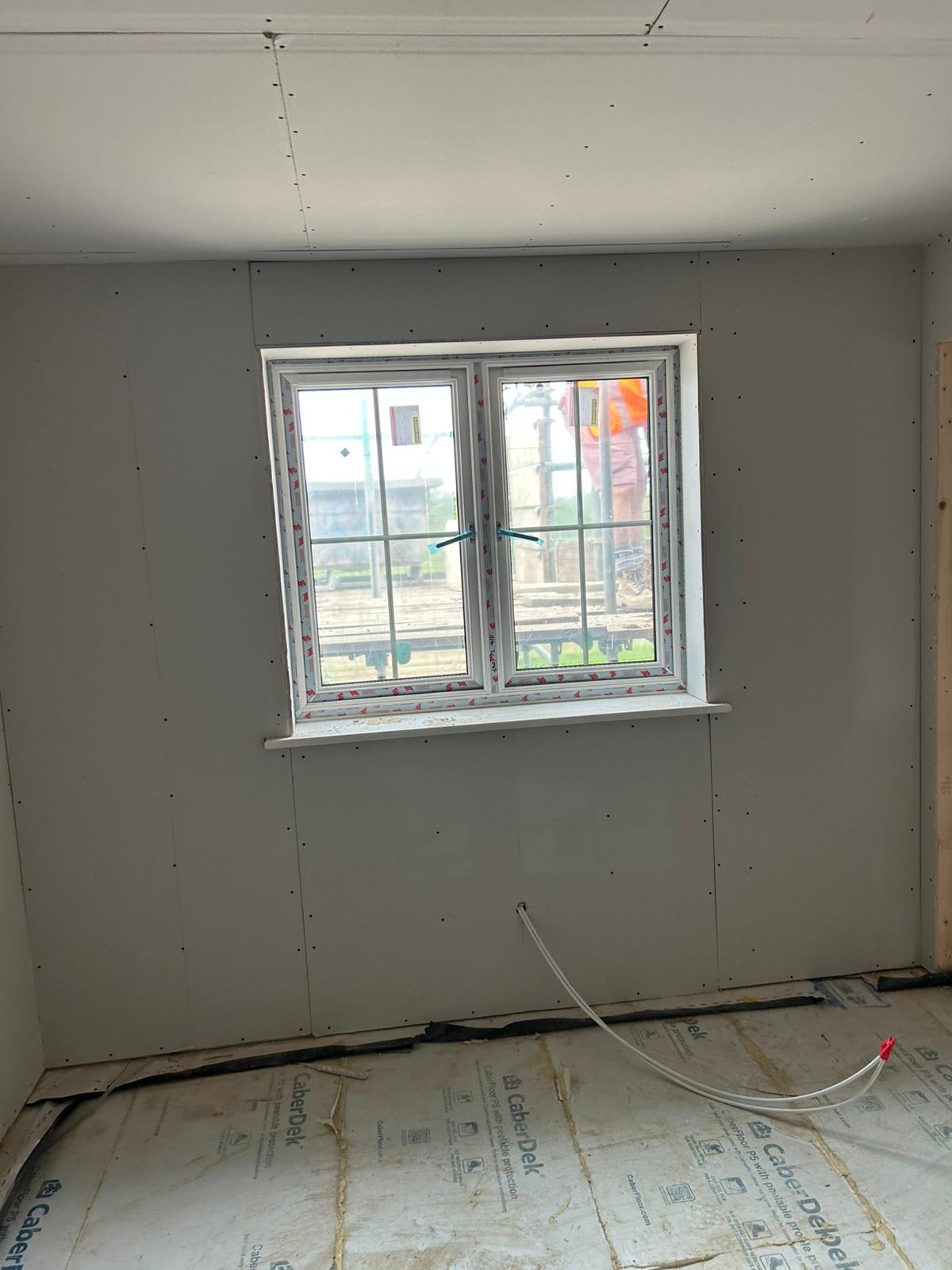 Fresh prepared walls with windows, low lighting