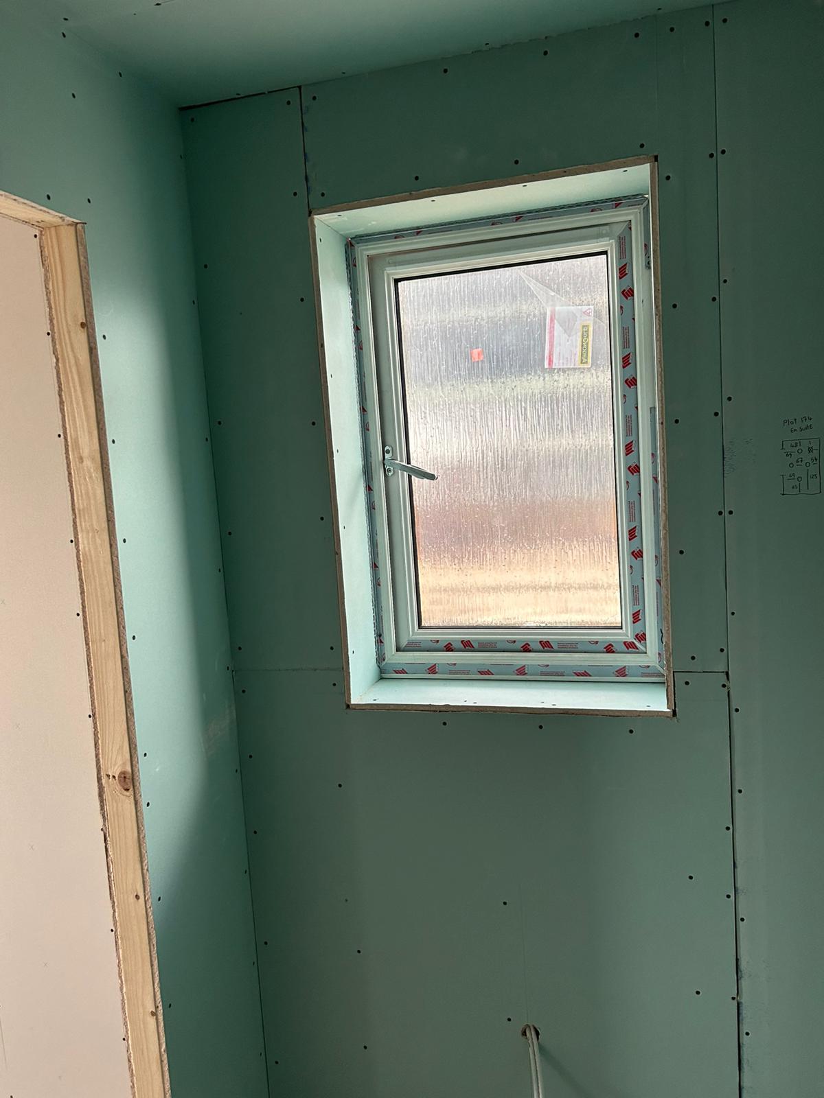 Fresh prepared walls with windows, low lighting