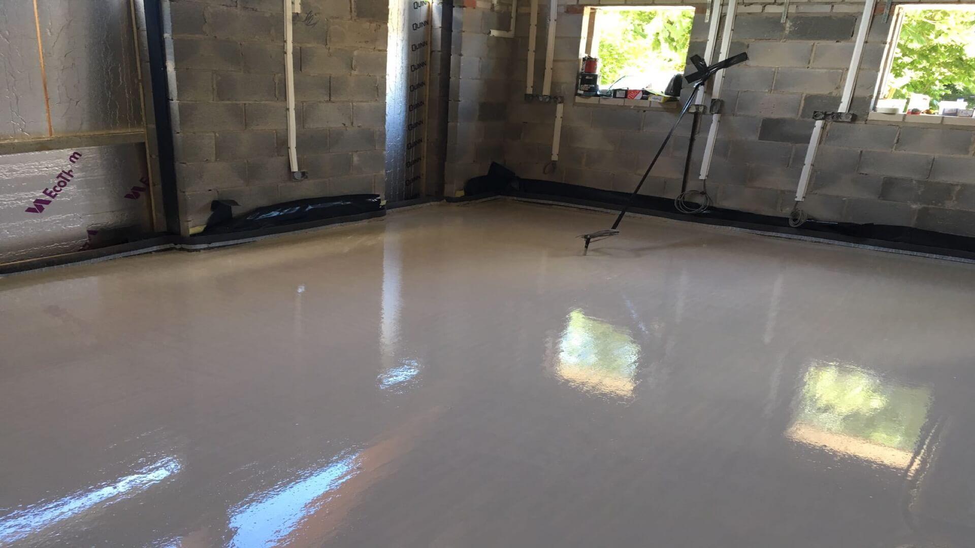 Shiny screed floor within partly constructed building