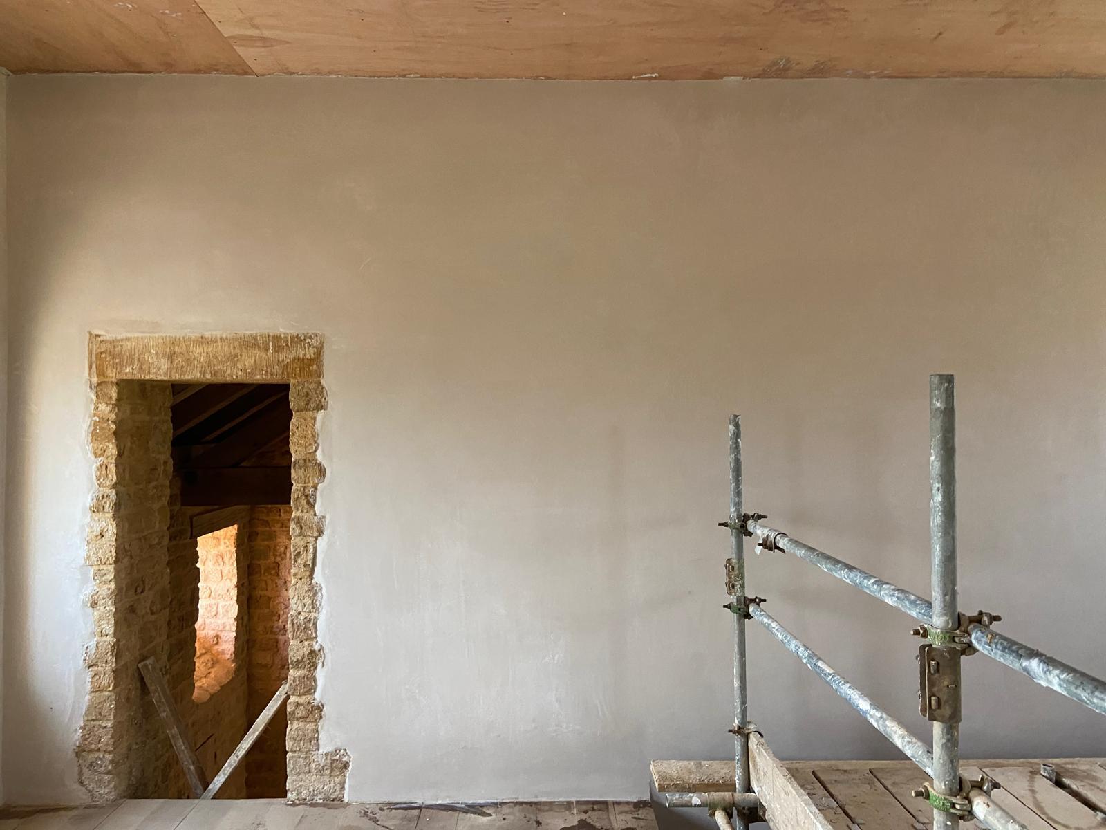 Example of smooth wall with old sone door wall present